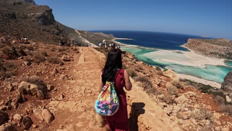 woman exploring the beauty of balos beach, chania, crete - wide shot