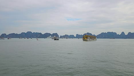cruise ships of ha long bay in northeast vietnam. wide shot