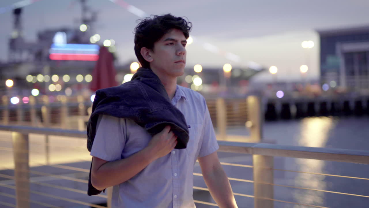 Man on a pier at night