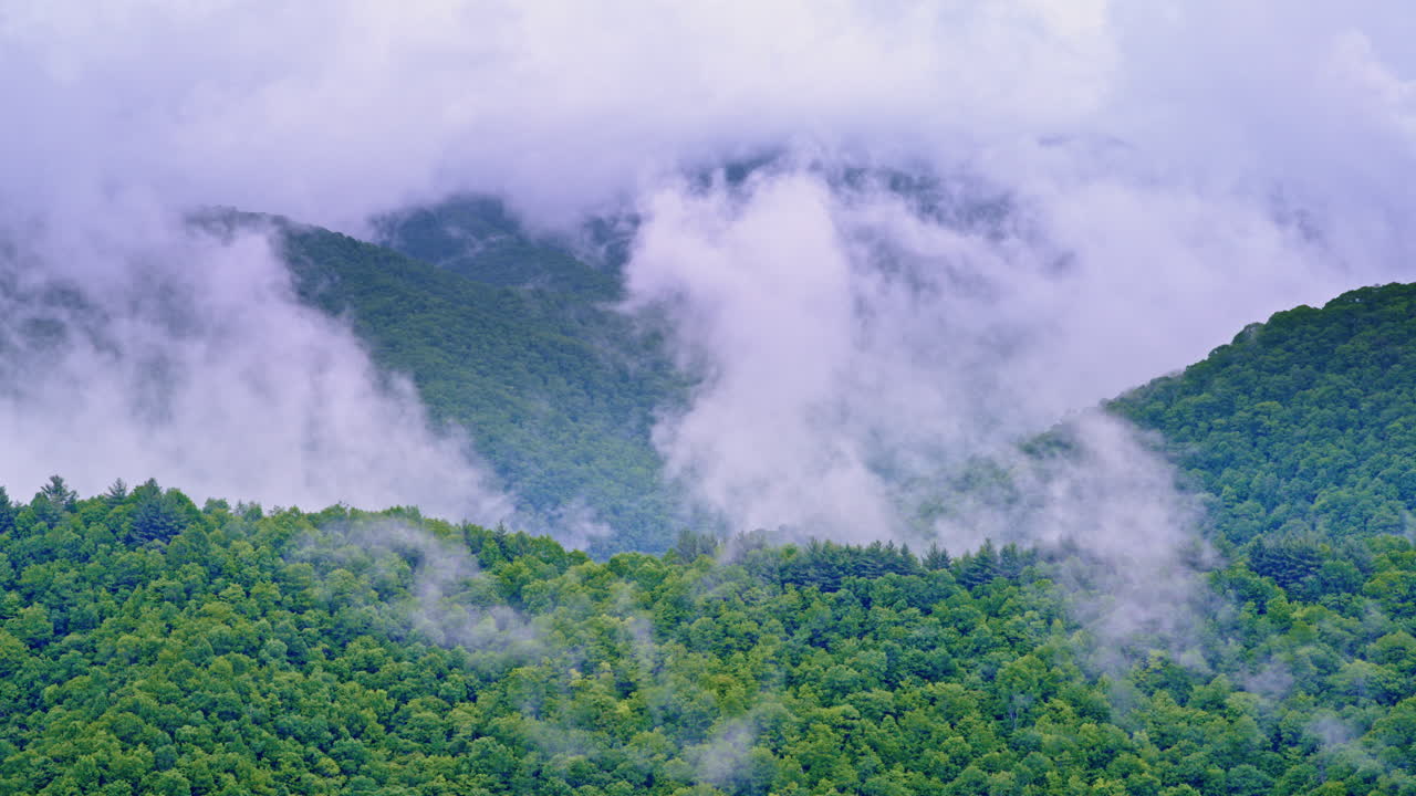Drone footage of the Smoky Mountains hidden by fog and haze