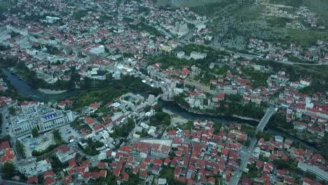 aerial view: neretva river flows through medieval mostar, bosnia