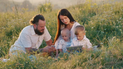 A-Stylish-Young-Woman-With-Long-Hair-Along-With-A-Bearded-Husband-And-Two-Small-Cool-Children-Watchi