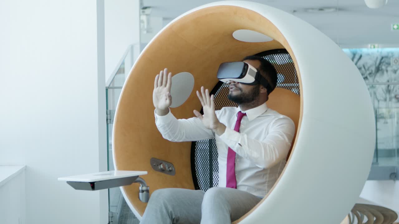Concentrated man in virtual reality headset