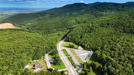 breath-taking scenery of green mountains covered by lush forests. highway crosses the woods. aerial perspective on the tatra mountains in slovakia