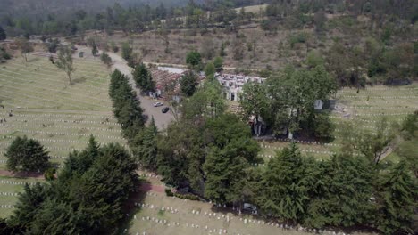 Aerial-shot-of-an-a-Mexico-City-pantheon,-mausoleums-on-a-Hill