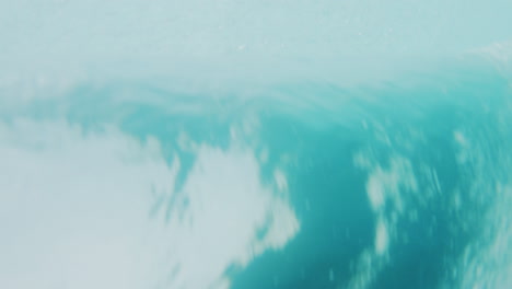 detailed closeup of ocean barrel rearview from underwater