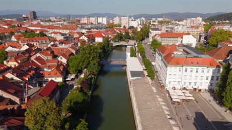 stunning drone footage of ljubljana, slovenia, showcasing the charming old town, the medieval castle, and the vibrant city center with its picturesque streets and unique architecture