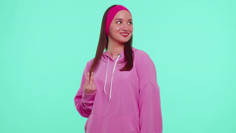 Cheerful-lovely-teenager-student-girl-fashion-model-in-pink-hoodie-smiling-and-looking-at-camera