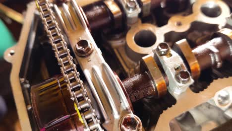 close-up of a car engine's timing chain and camshaft