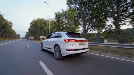 audi e-tron sportback concept four wheel drive electric suv. presentation of a new car model. fast driving drifting in city