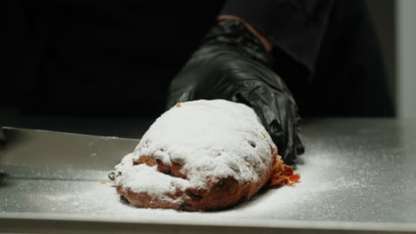 chef cutting a festive stollen