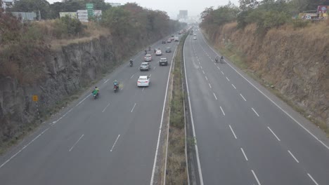 Multi-lane-Mumbai-Bangalore-highway-traffic-near-Pune,-road-travel-in-India