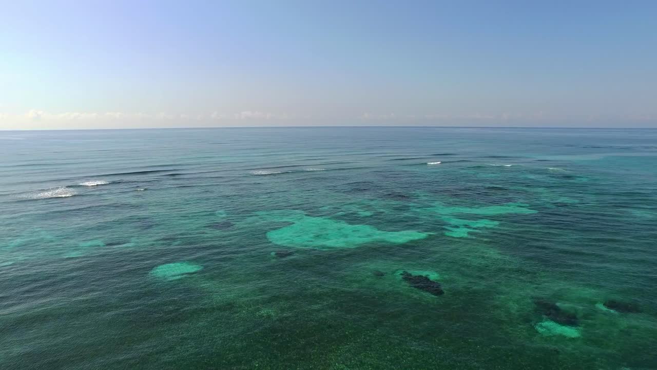 Aerial shot of a coral reef in The Riviera Mata