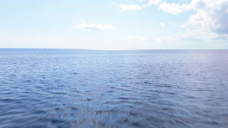 Aerial-low-pullback-above-sparkling-Caribbean-tropical-waters