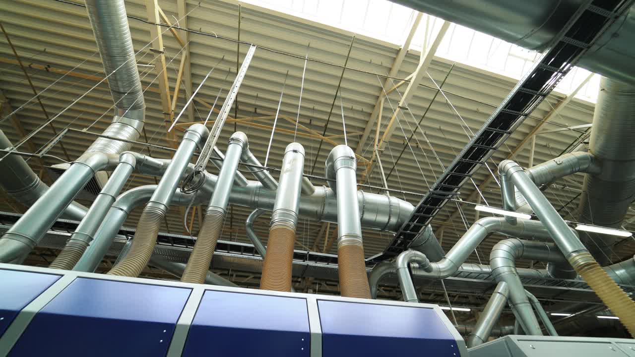Industrial zone. Steel pipelines, valves, cables and walkways