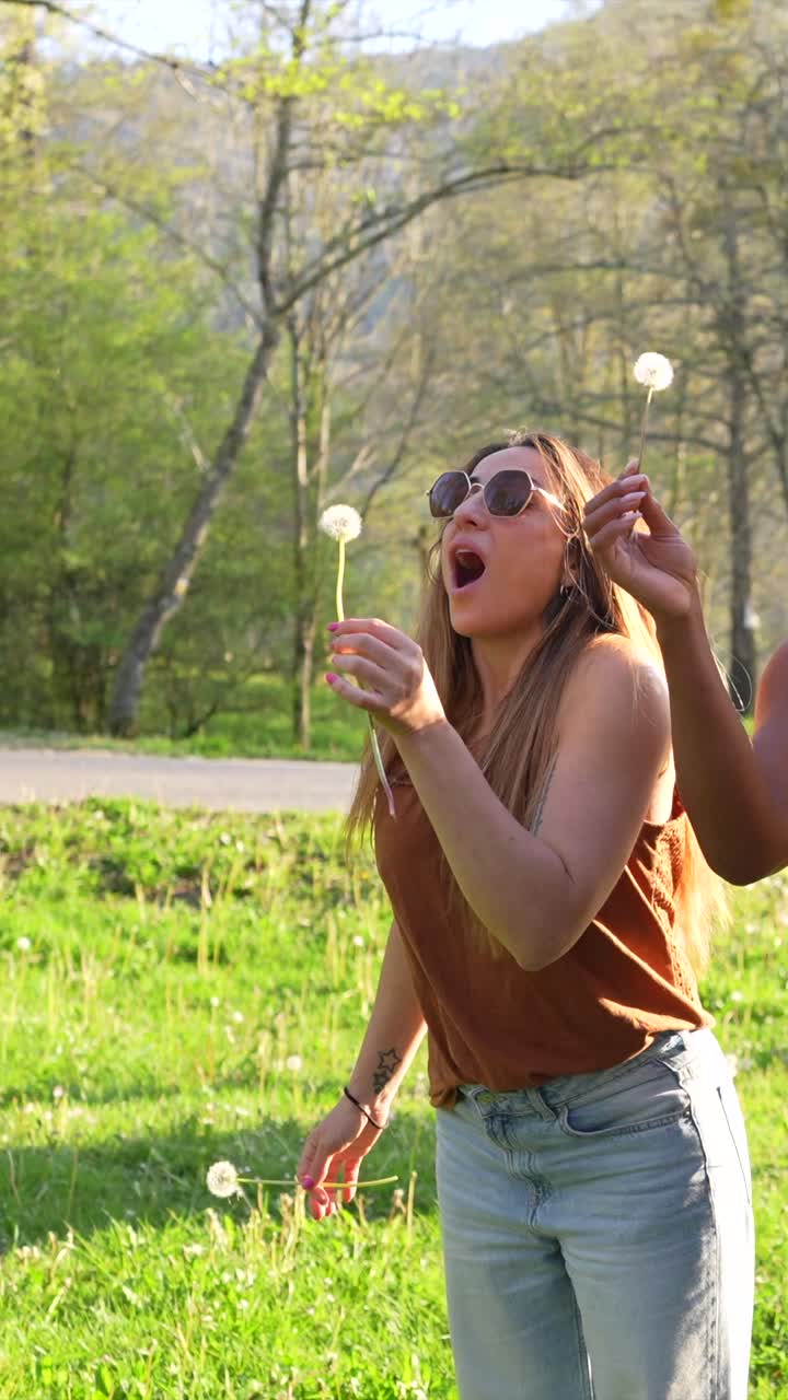 Women Enjoying Dandelions Outdoors