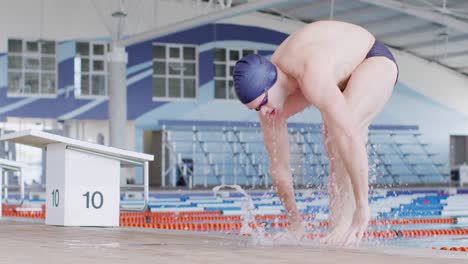 swimmer coming out of pool