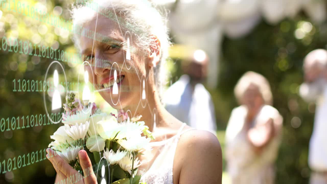 Senior woman adjusting bouquet while camera pulling back, revealing binary overlay for wedding