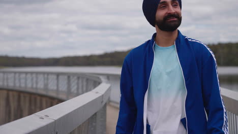 A-Punjabi-Sikhi-Man-With-Mustache-Walking-On-The-Bridge