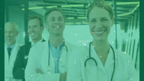 medical team wearing lab coats, stethoscopes, suits in corridor showing digital data nodes overlay