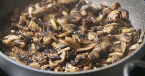 mushrooms being cooked in pan s 1