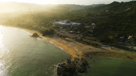 Aerial-shows-luxury-hotel-along-coastline-of-Kuta-Mandalika,-sunrise