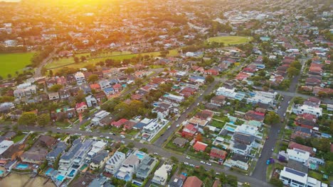 Drone-of-houses-and-horizon-in-Sydney,-Australia-7