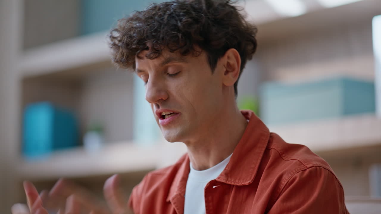 Frustrated boss gesturing webcam engaging in online discussion at office closeup
