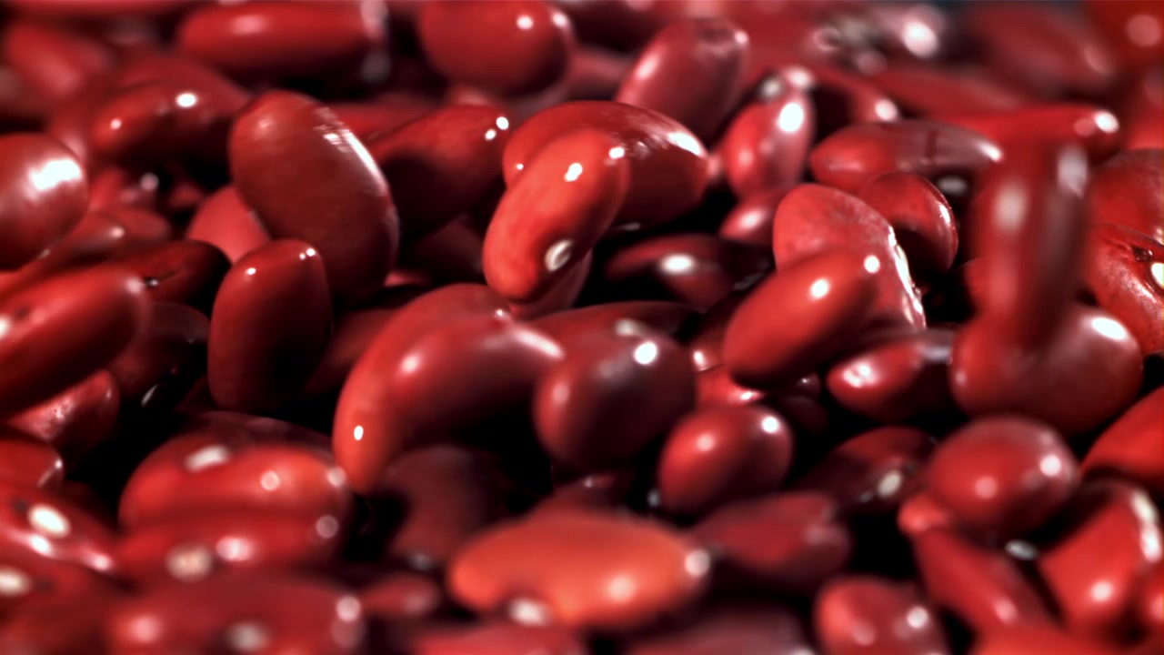 Close Up of Wet Red Kidney Beans Falling in Slow Motion