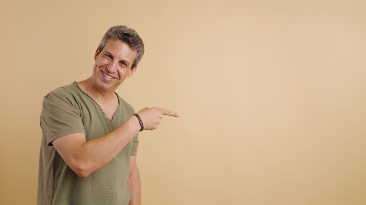 Man pointing and smiling