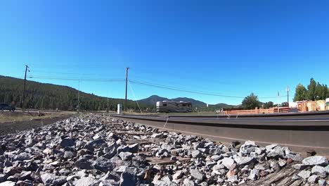 low angle of a large rv crosses the railroad tracks in williams, arizona vehicle