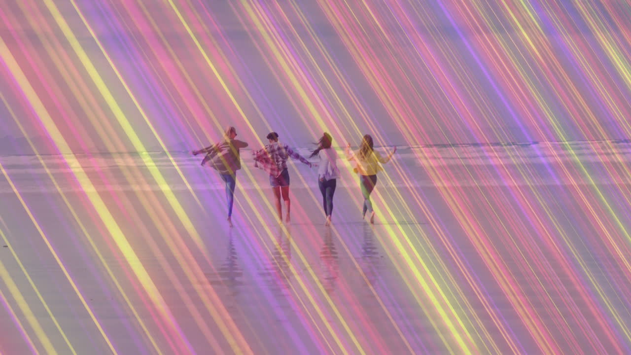 Running on beach, four people with colorful animation light streaks overlay