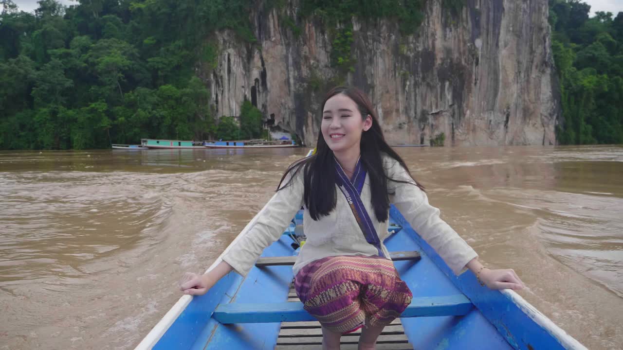 Happy Woman on a Boat on a River