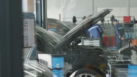 cars undergoing maintenance in auto repair shop