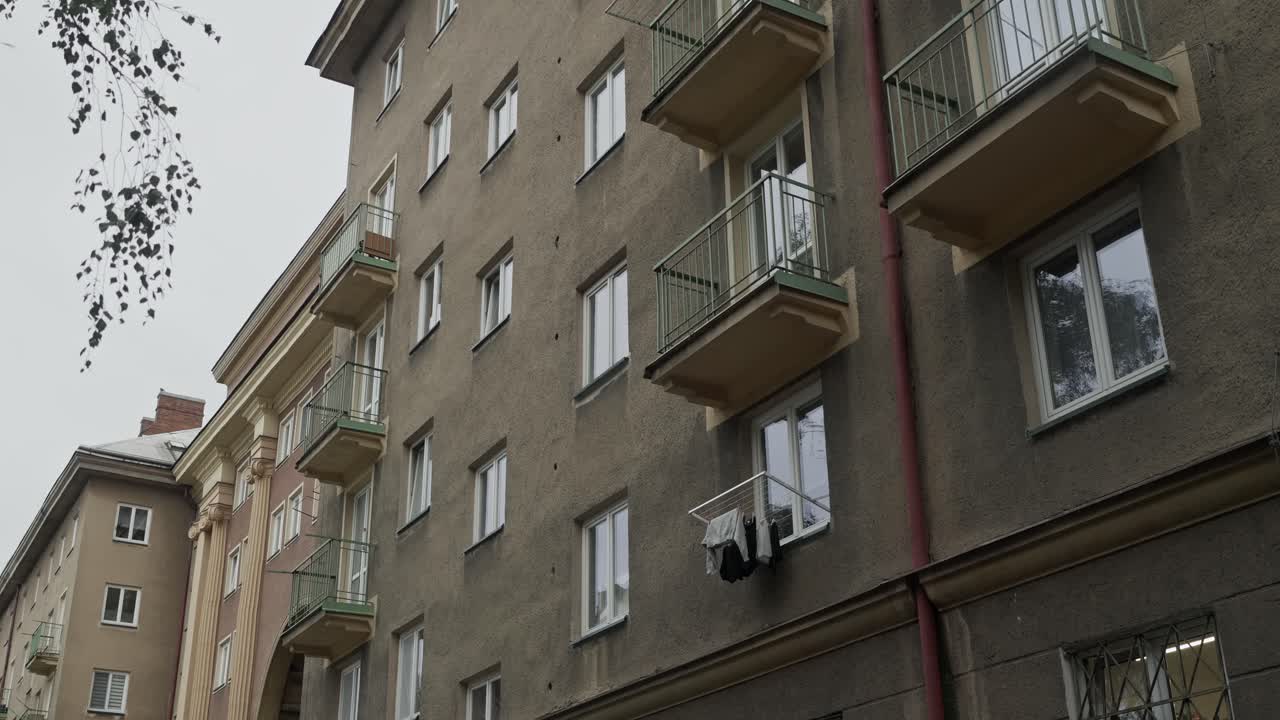 Laundry hangs outside soviet era urban social housing apartment block