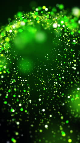 green lights shimmering in sky. resembling drops of dew floating in air against a dark background, creating a magical and glittery effect. vertical loop video.