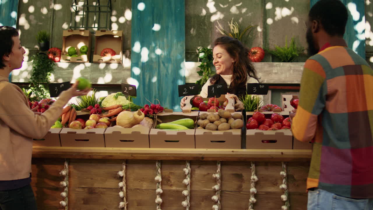 People buying fresh produce at a farmers market
