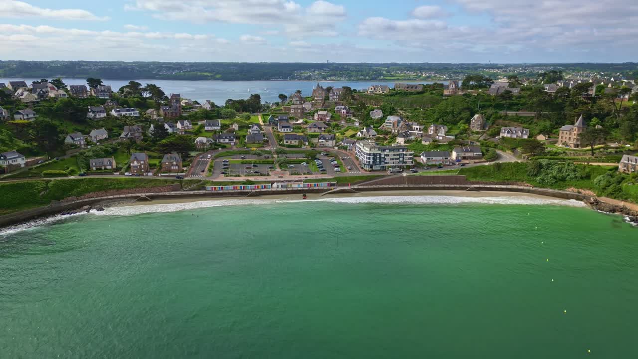 Panorama drone view of coastal Perros-Guirec settlement residential areas with beachside, Côtes-d'Armor, Brittany, France.