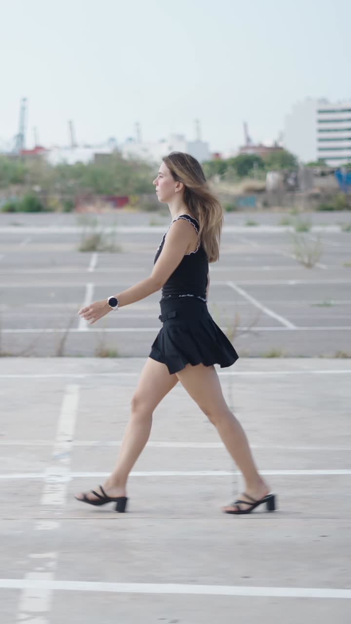 Woman Walking in Parking Lot