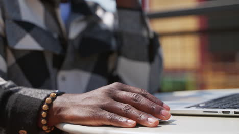 man working on a laptop outdoors