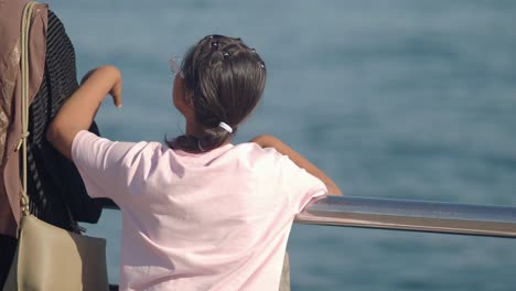 girl looking at the ocean