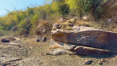 static shot showing show huge rocks are hidden under the mountain, metamorphic rocks, often found in mountain ranges, are formed by high pressure and heat