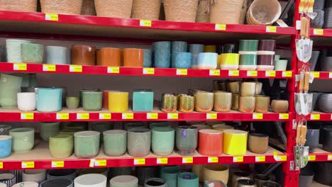 shelves filled with various colorful plant pots