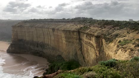 the twelve apostles, a major tourist highlight of australia, great ocean road, pan left, slow motion