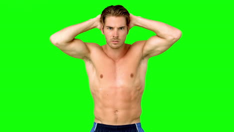 shirtless man flexing muscles