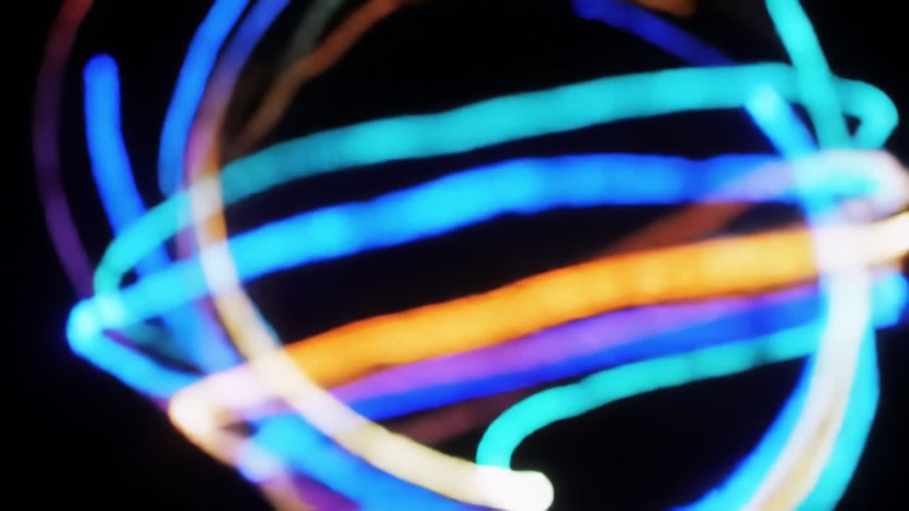 A Vibrant Display of Colorful Light Trails Emphasizing Movement and Energy in a Captivating Abstract Composition