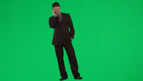Businessman-on-mobile-phone-against-green-screen-footage