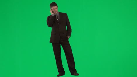 businessman on mobile phone against green screen footage