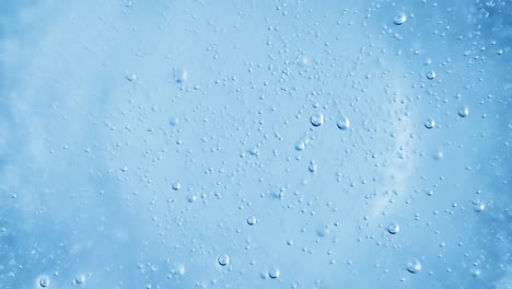 oxygen bubbles in water on a blue abstract background