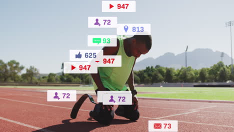 animation of social media icons over african american man with prosthetic leg celebrating on track